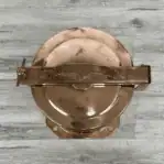 Copper Fresnel lens light – top view showing handle and thumbscrew
