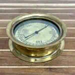Top view of a vintage brass gauge