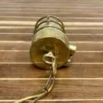 Top view showing the brass eye hole and chain attachment for hanging the light.