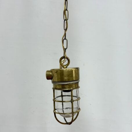 Chain Hung Brass Engine Room Ceiling Light (3) Chain Hung Brass Engine Room Ceiling Light with a clear view of the brass eye hole and chain attachment.