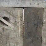 Close-up of splintered wood and gap on Liberty Ship hatch cover