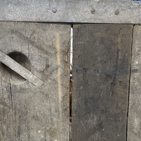 Authentic Liberty Ship Hatch Cover Close-up of splintered wood and gap on Liberty Ship hatch cover