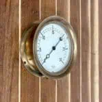 Side view of vintage brass gauge by Jas P Marsh & Company Chicago.