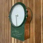 The Vintage Copper Self Recording Thermometer - Draper's New York, NY on a wall