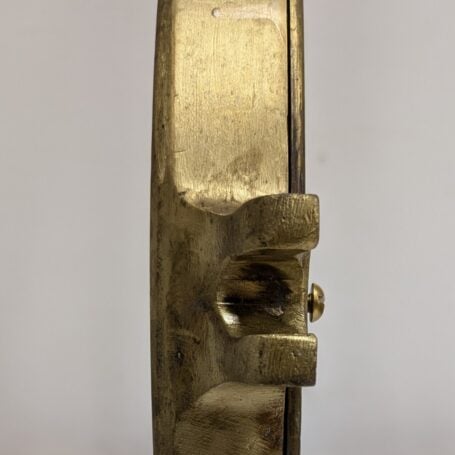 Side view of large brass porthole cover