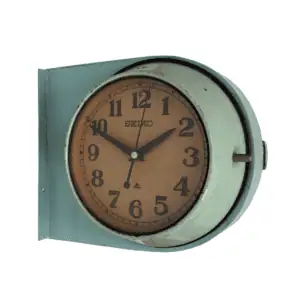 Nautical Wall Clock by Seiko with a double-sided design, showcasing its two-tone metal frame and vintage maritime style.