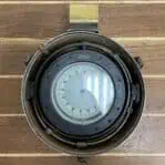 Interior view of brass binnacle compass with visible compass card
