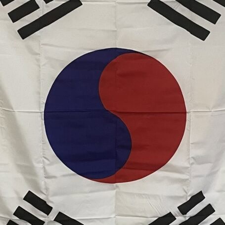 South Korea Ship Flag - Nautical Taegeukgi (3) Close-up of the South Korea ship flag showing the red and blue Taegeuk circle and surrounding trigrams.