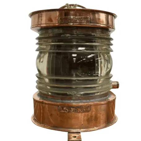 Large copper nautical light with thick Fresnel lens and aged patina