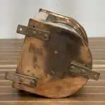 Mounting base and brackets on bottom of copper nautical light