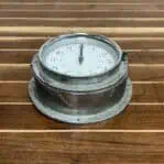 Main: Front view of Vintage Nautical Aluminum Clock with COOKE HULL dial and glass lens