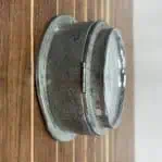 Side Angle: Alternate side view of Vintage Nautical Aluminum Clock with visible aging and texture