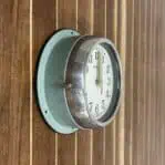 Side Angle 2: Vintage ship's wall clock by Kappa from the side showing clock depth and mounting holes