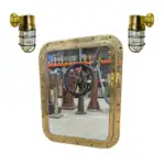 Salvaged brass porthole mirror with two brass ship lights, displayed together as a nautical decor set.