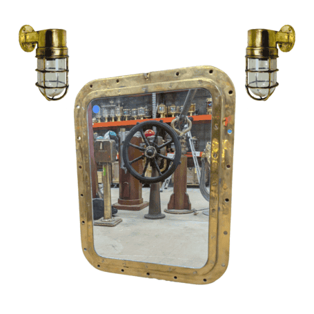 Brass Dock Lights with Brass Porthole Mirror Set Salvaged brass porthole mirror with two brass ship lights, displayed together as a nautical decor set.
