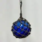 Vintage blue sea glass float used by fishermen, coastal home accent