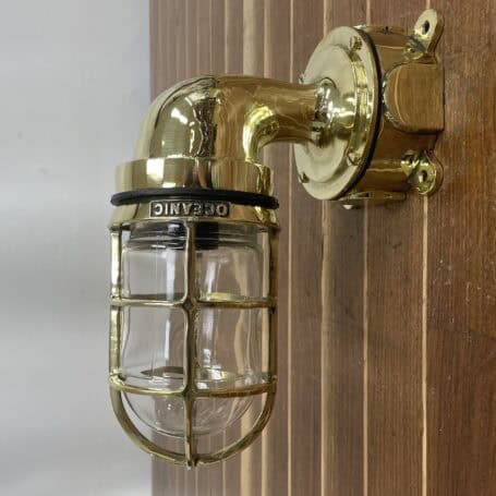 Nautical Wall Sconce - Brass (No Cover) Mounted brass nautical wall sconce with clear globe and polished finish