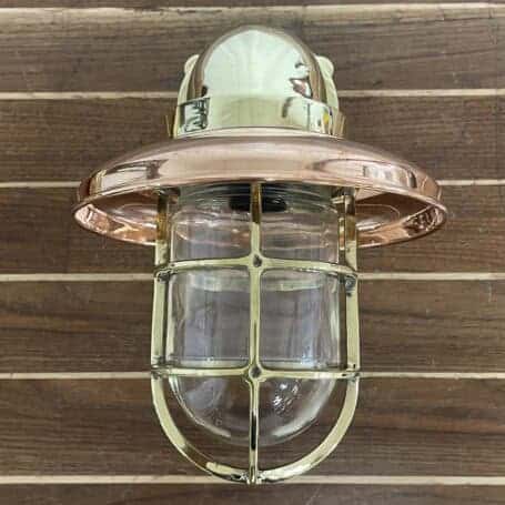 Nautical Wall Sconce - Brass (Copper Cover) Brass nautical wall sconce with copper rain cap and clear globe – front view