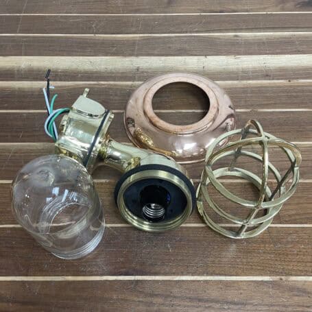 Nautical Wall Sconce - Brass (Copper Cover) Brass nautical wall sconce disassembled, displaying internal wiring and parts
