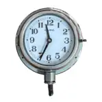 Main view: Main view of nautical clock with original conduit wiring, showing white dial and chrome-rimmed face