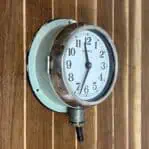 Side angle (2): Alternate side angle of nautical clock with original conduit wiring, steel case with surface wear