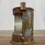 Alternate side view of copper Fresnel lens navigation light with aged finish and wiring port.