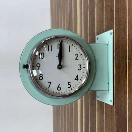 Salvaged Seafoam Double-Sided Ship Clock - Made by Citizen Salvaged Seafoam Double-Sided Ship Clock highlighting its sturdy wall mount.