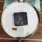 View of the clock’s battery-operated quartz mechanism for easy maintenance.