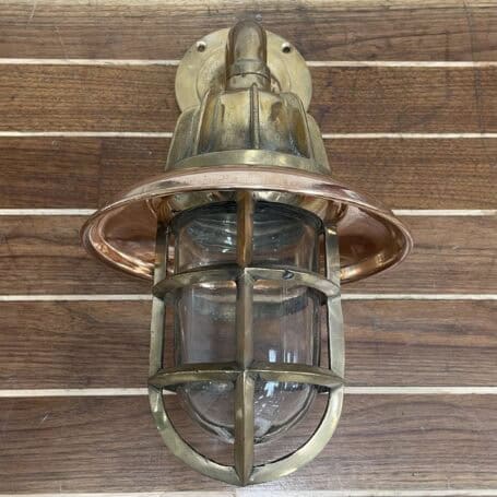 Vintage Brass Gooseneck Wall Sconce - Copper Rain Cap looking straight down onto the Vintage Brass Gooseneck Wall Sconce - Copper Rain Cap