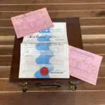 Original Cassens & Plath certificates resting on case lid