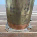 Close-up of broken base corner on vintage copper starboard navigation light.