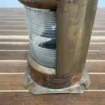Side angle of vintage copper starboard navigation light showing “Starboard” tag and clear lens.