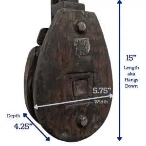 Vintage wooden pulley with dimensions marked for reference