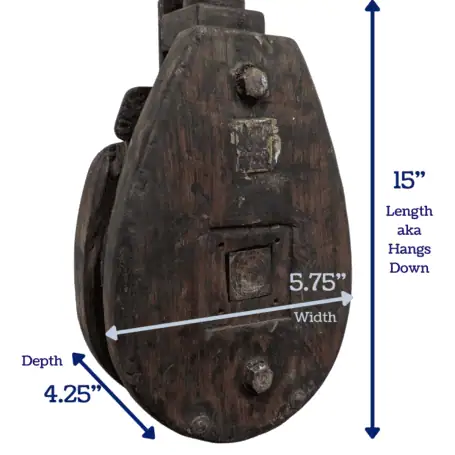 Vintage wooden pulley with dimensions marked for reference