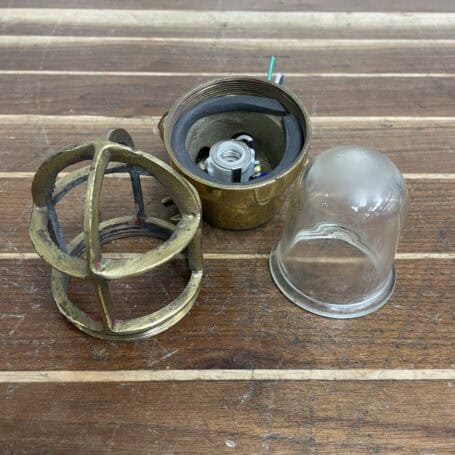 Mini Brass Ceiling Light - Vintage 5-Inch Nautical Fixture 01 Mini brass ceiling light disassembled showing glass dome, cage, and internal wiring