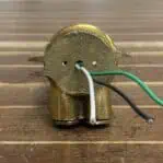 Back view of mini brass ceiling light showing exposed wires for installation