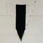 Vintage maritime signal flag hanging on display wall with visible grommets and rope.