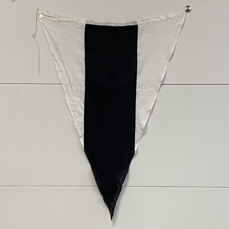 Nautical-ICS-3rd-Substitute-Signal-Flag-48-x-33-2 Vintage maritime signal flag hanging on display wall with visible grommets and rope.