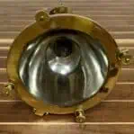 Bottom view of the pendant showing lens and securing knobs