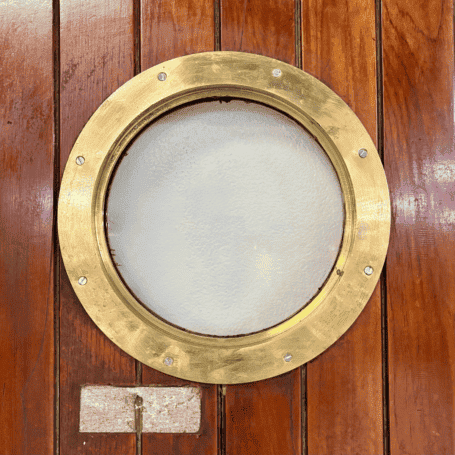 Salvaged Ship Door with Porthole (3) Rear close-up of brass ship porthole window in wood door