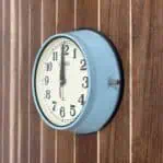 Side Angle 2: Seiko Blue and Cream Ship Clock from another side showing thumbscrew and housing details