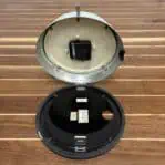 Open Showing Clock Mechanism: Open clock case revealing battery compartment and inner components