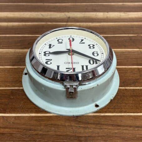 Seiko Seafoam Wall Slave Clock - Battery Operated, 1990s (4) Top angle showing the curvature and metal housing of the clock