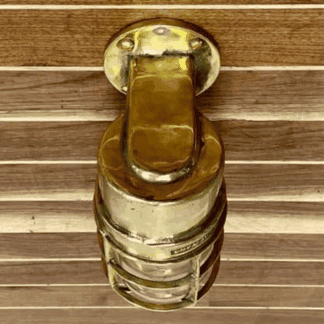 Solid Brass Dock Light (3) Top view: Overhead view of solid brass dock light displaying the rounded top and mounting features