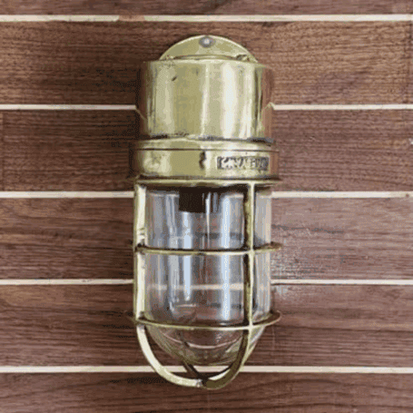 Solid Brass Dock Light Front view: Front view of solid brass dock light highlighting the thick glass lens and sturdy marine-grade build
