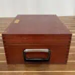 Wooden storage box for TAMAYA sextant featuring carry handle