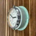 Side angle of vintage Seiko slave clock showing chrome bezel
