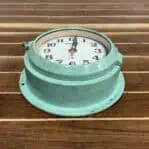 Bottom Angle: Bottom angle of vintage Seiko wall clock showing case condition and frame details