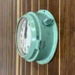 Side Angle 1: Side view of vintage Seiko wall clock showing seafoam casing and adjustment knob