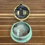 Open Showing Mechanism: Interior view with clock open, showing battery compartment and inspection date